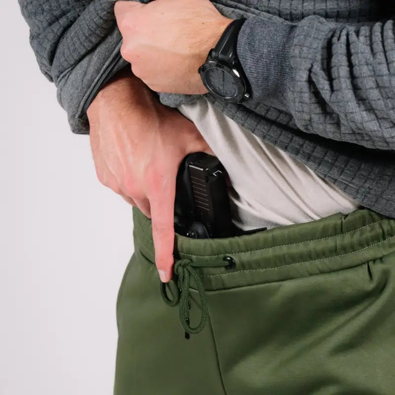 Concealed handgun in hand pocket of Standoff Concealment Hoodie Mk.II for standoff concealment