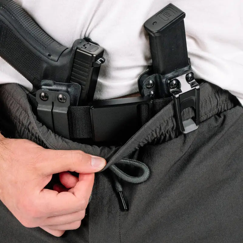 Concealed handgun and magazine displayed with Enhanced Rapid Clasp Retention Belt