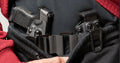 Concealed handgun and magazine holsters with OmniCarry Retention Belt for secure carry