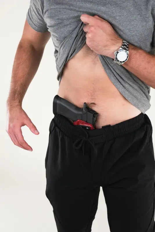 Concealed carry in waistband of Carrier Traveler Joggers - Midnight Black for discreet safety