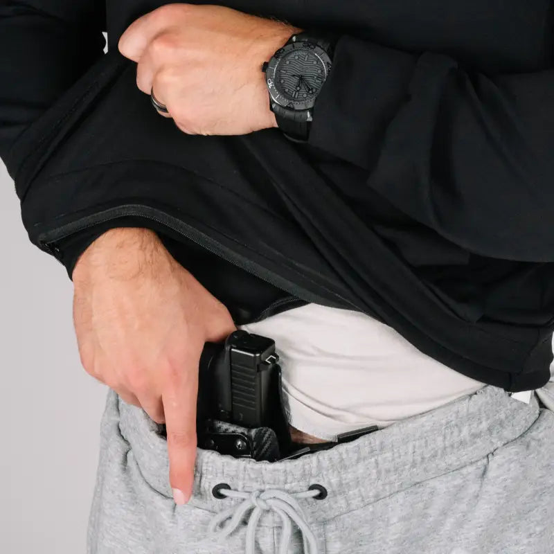 Concealed handgun in waistband worn with durable quarter zip for discreet safety and comfort