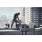 Construction worker using Husqvarna K 1 PACE battery powered rescue power cutter on rooftop