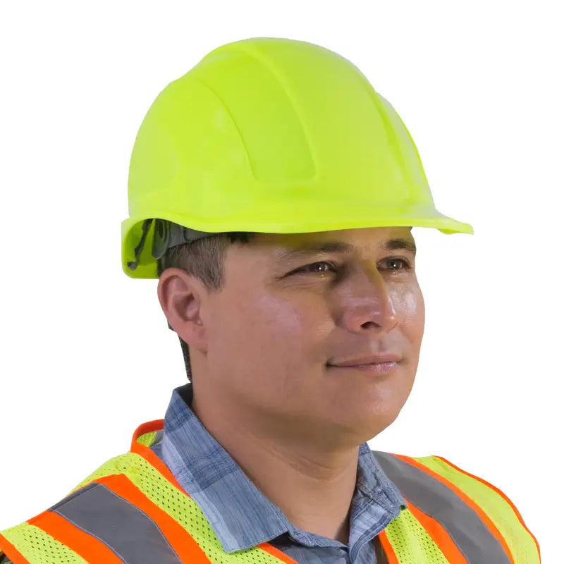 Construction worker wearing a cap style safety hard hat with 4 point suspension