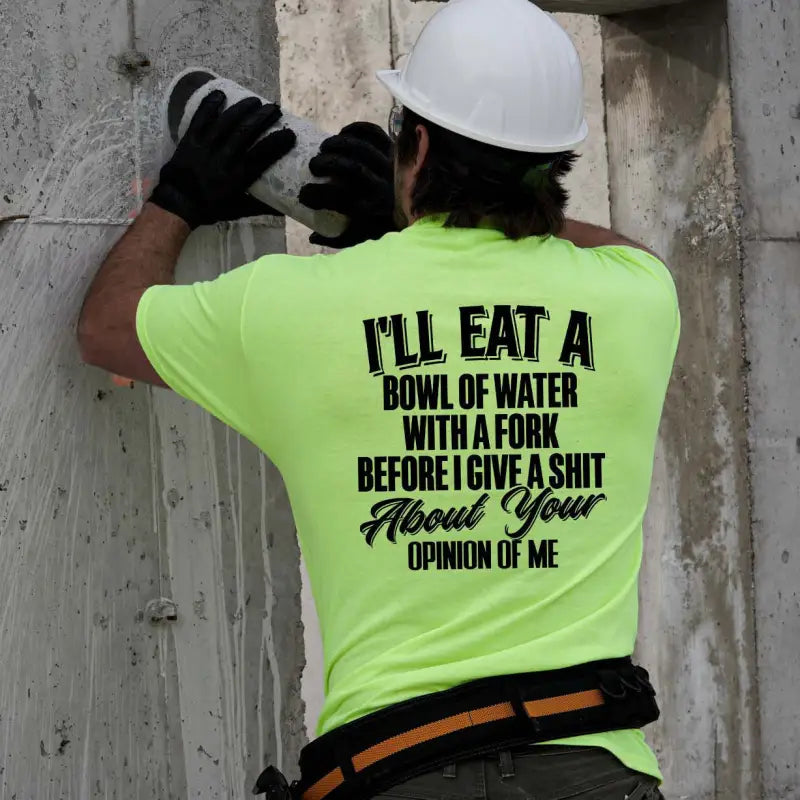 Construction worker in a safety yellow t-shirt with a humorous design