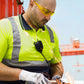 Construction worker grinding metal while wearing clear safety glasses for high impact protection