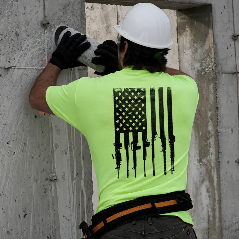 Construction worker wearing a Rifle Flag safety yellow t-shirt for patriotic style