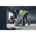 Construction worker in safety gear using Husqvarna K 1 PACE Battery Powered Rescue Power Cutter