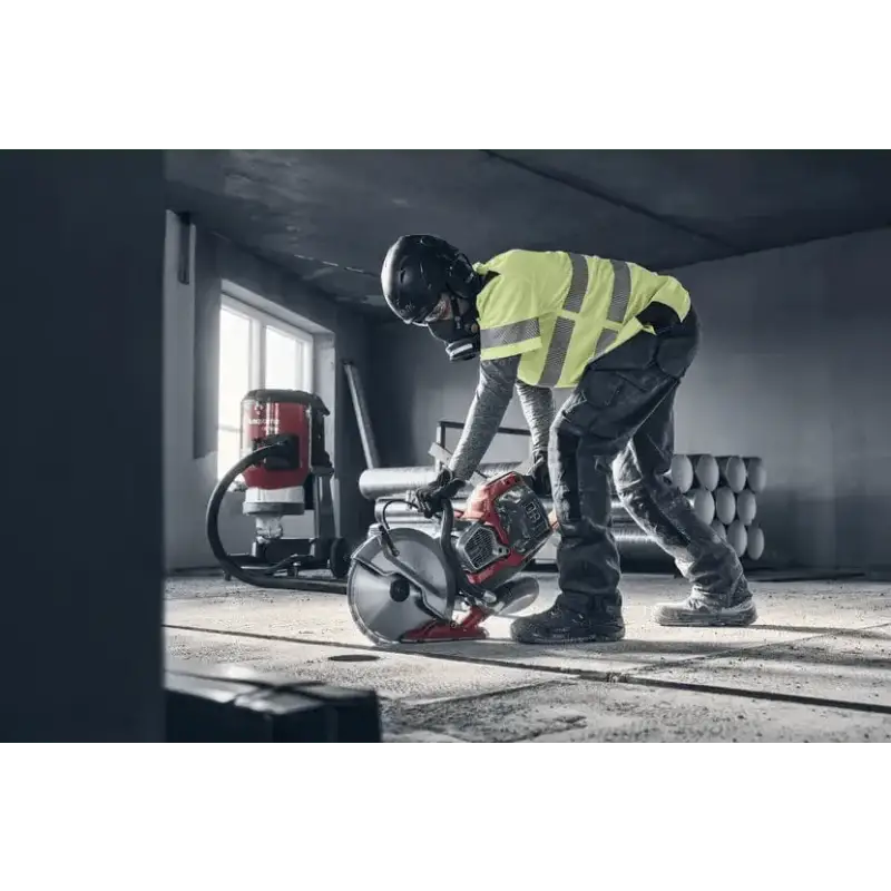 Construction worker in safety gear using Husqvarna K 1 PACE Battery Powered Rescue Power Cutter