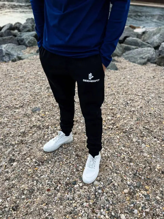 Black Cotton Joggers- Equipped with white logo paired with stylish white sneakers