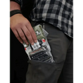 A hand holding a crushed Diet Coke can with SLIK-KIT, ideal for first responders