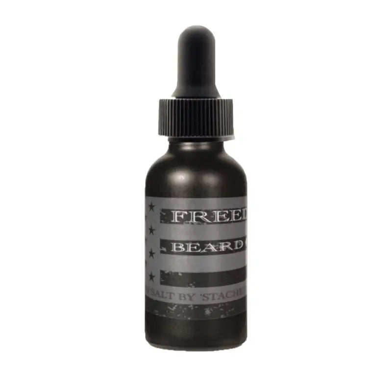 Dark bottle with dropper cap labeled Freedom Beard Oil for a nourished beard