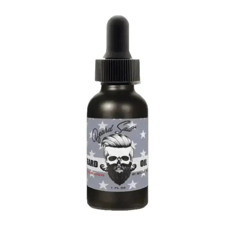 Dark dropper bottle of Ol’ Fashion Beard Oil with bearded skull logo and stars