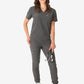 Dark gray women’s tuckable one-pocket scrub uniform with jogger-style pants and v-neck top