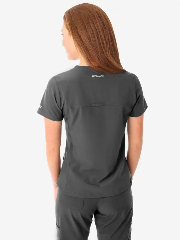 Dark gray women’s stash-pocket scrub top displayed from the back view