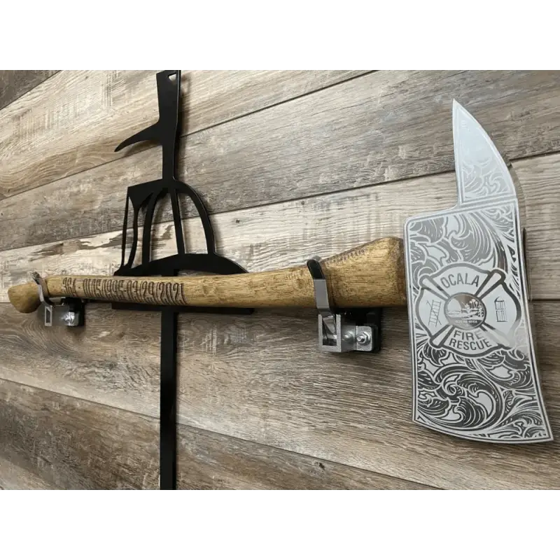 Decorative personalized axe with engraved blade and rustic handle mounted on brackets