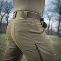 M-Tac Tactical Pants Sahara Flex Light with various pockets demonstrated, ideal for carrying essentials securely.