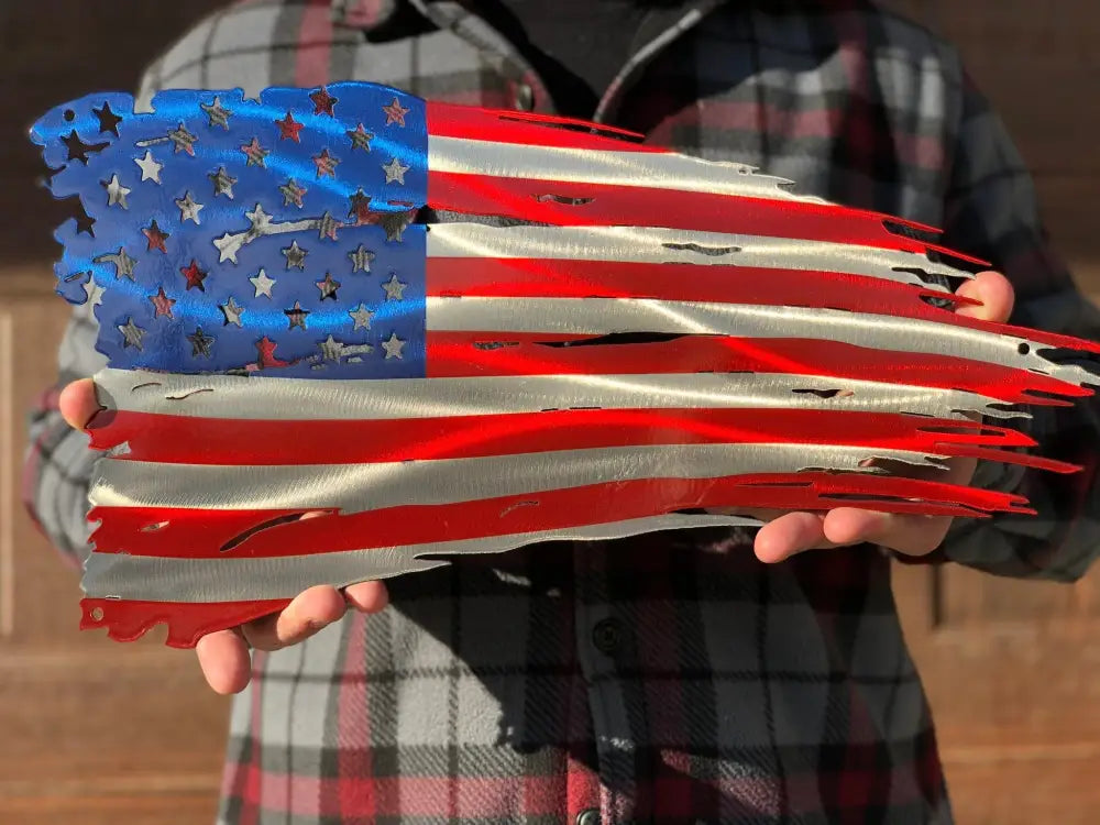 Distressed American Battle Flag metal wall art features a tattered red silver blue design