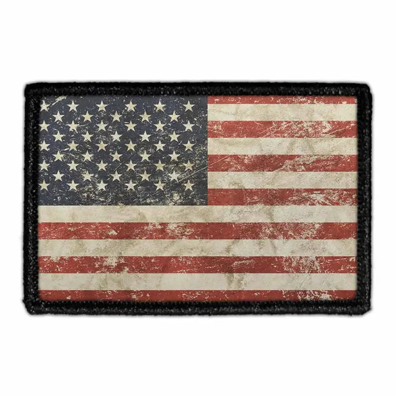 Distressed American flag removable patch on a velcro loop surface for vintage appeal