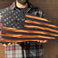 Distressed American Battle Flag featuring orange-tinted stripes on black background