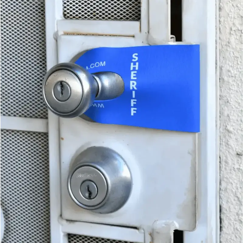 Door handle and lock mechanism with blue tag for Sheriff DoorJamm, perfect for first responders