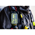 E29 sensor on dark gear with neon yellow, part of IdentiFire SCBA Accountability Shoulder Strap System