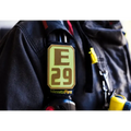 E29 IdentiFire device attached to clothing in IdentiFire SCBA Accountability Shoulder Strap System