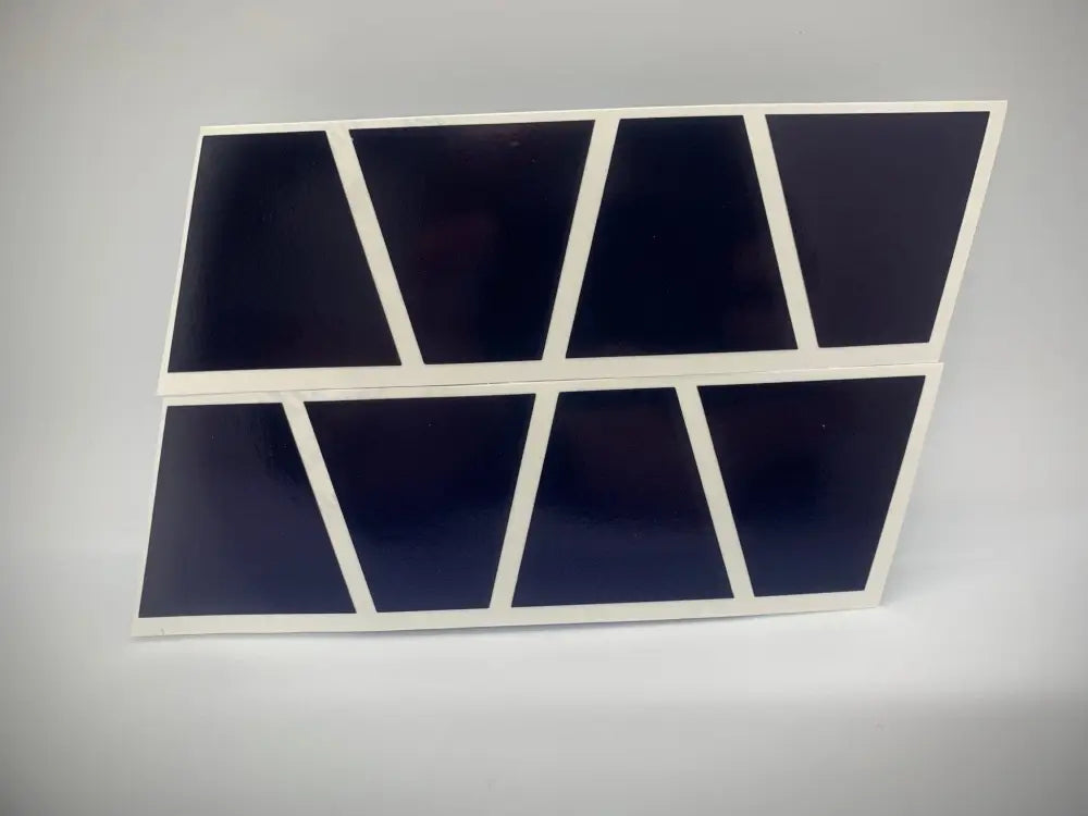 Eight black triangular panels in a white frame for the Blue Reflective Helmet