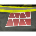 Eight matte dark red reflective helmet shapes with pointed corners in two rows