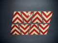 Eight red chevron reflective tiles in a pattern for BLACKED OUT BLACK AND RED CHEVRON REFLECTIVE HELMET