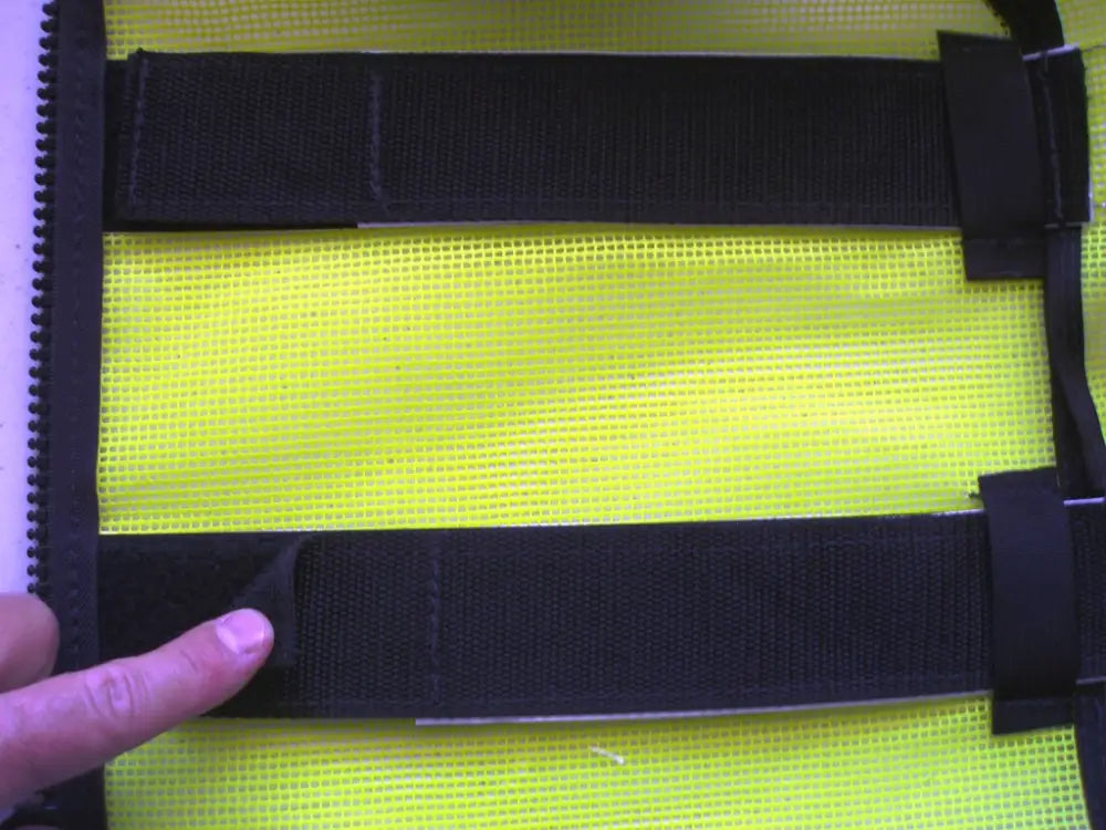 High visibility vest made of fluorescent green and black reflective material meeting ANSI II requirements