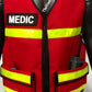 Red EMS reflective vest with lower pockets and ’MEDIC’ patch for emergency services