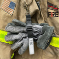 Firefighter gloves hanging from a clip on FRE Fire Glove Strap for quick access