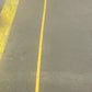 Firefighter in harness with long yellow strap for personal carry and fireground applications
