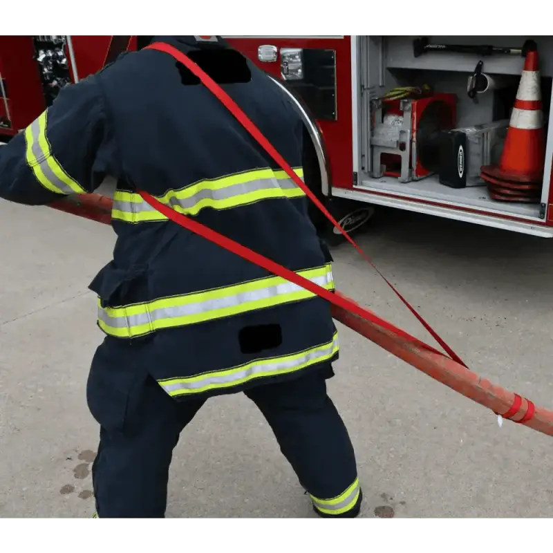 Firefighter in navy uniform with reflective stripes using multi-use sewn webbing loop