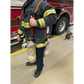 Firefighter in protective gear using SCBA Bottle Carrying Sling for carrying bottles