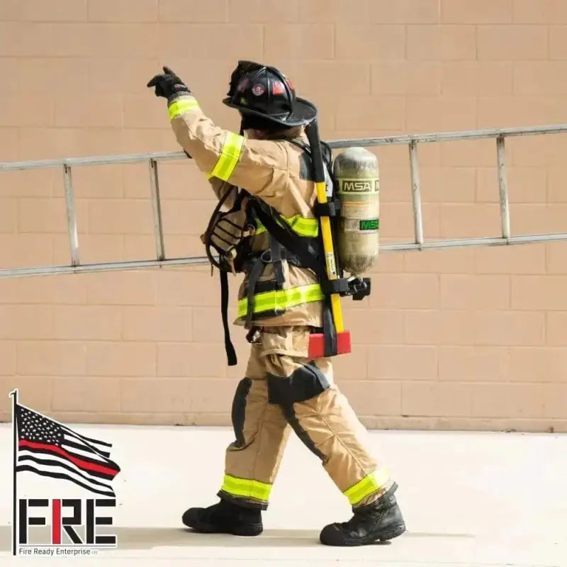 Firefighter in protective gear using a tool shoulder strap for equipment shoulder carry