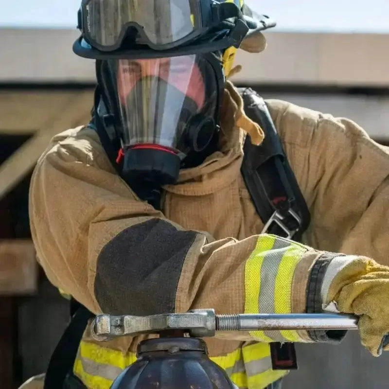 Firefighter in protective gear using XRT PRO 2.0 SCBA Trainer for training