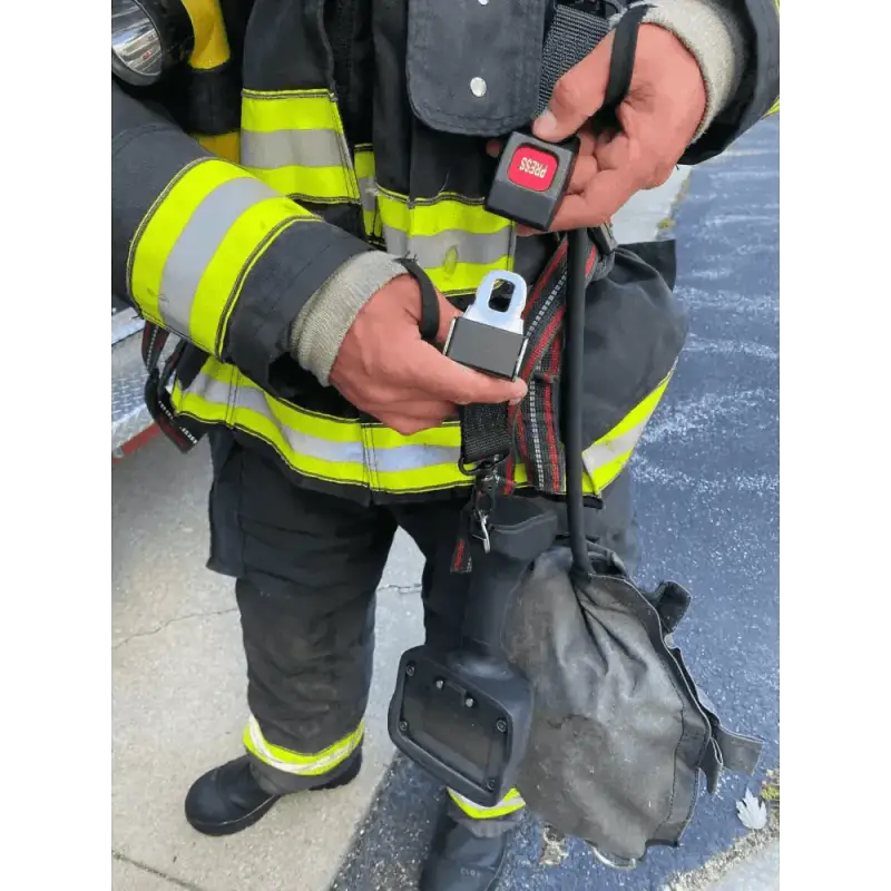 Firefighter in protective gear using TIC Strap - FFTIC for first responders equipment