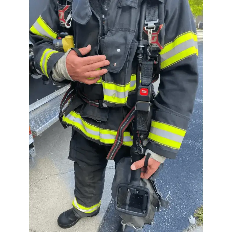 Firefighter in protective gear with TIC Strap - FFTIC for first responders safety