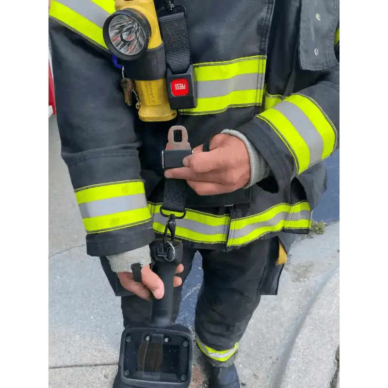 Firefighter in reflective gear using TIC Strap - FFTIC for safety and support