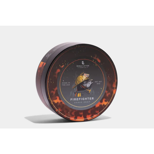 Circular tin container of Firefighter Shave Soap with a flames design and black lid