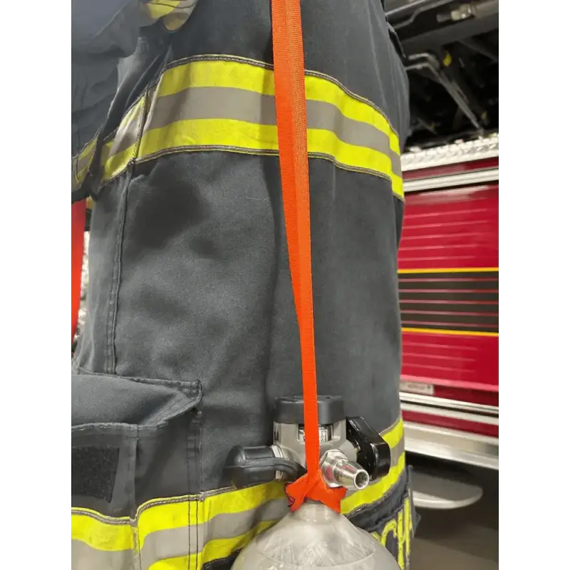 Firefighter turnout gear with reflective stripes and orange strap for SCBA bottle carrying