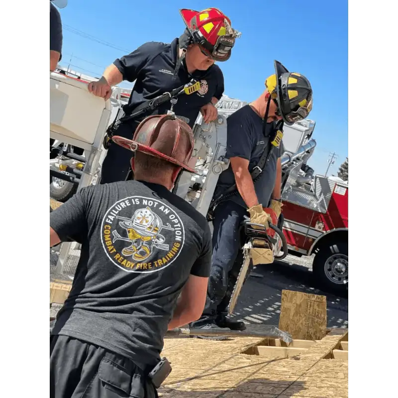 Firefighters training with axes in shortsleeve black soft t-shirt with large logo