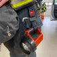 Firefighter’s handheld spotlight and Flashlight Strap-FFFS attached to gear