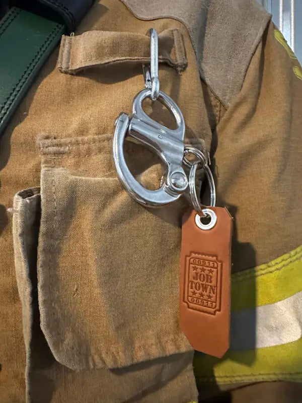 Firefighter’s tan jacket with 50mm quick release clip and JOBTOWN keychain accessory