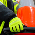 Fluorescent Hi-Vis Touchscreen Safety Work Gloves holding a traffic cone for high visibility