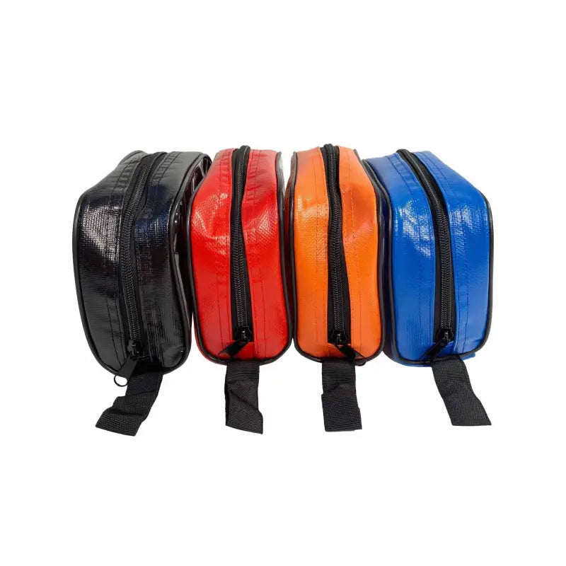 Four zippered toiletry bags in black, red, orange, and blue for a First Aid Medical Kit