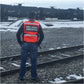 Worker wearing FRA Safety Reflective Vest for enhanced visibility and safety on duty