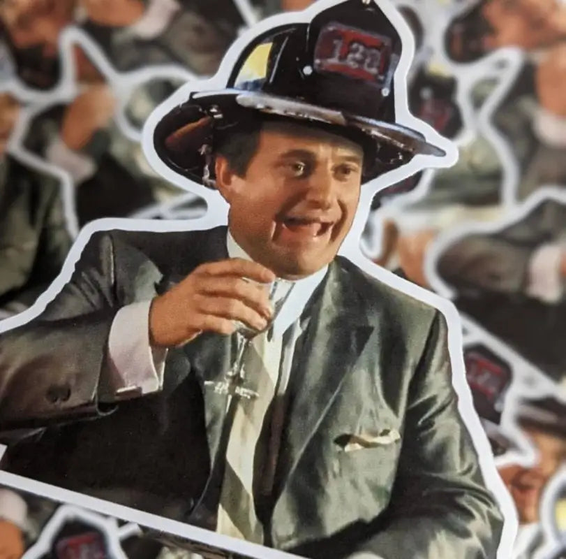 Smiling firefighter in a suit with champagne glass, featured on Funny How Sticker