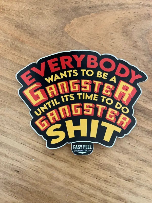 Sticker showcasing bold text reading Everybody wants to be a gangster on Gangster S**t product
